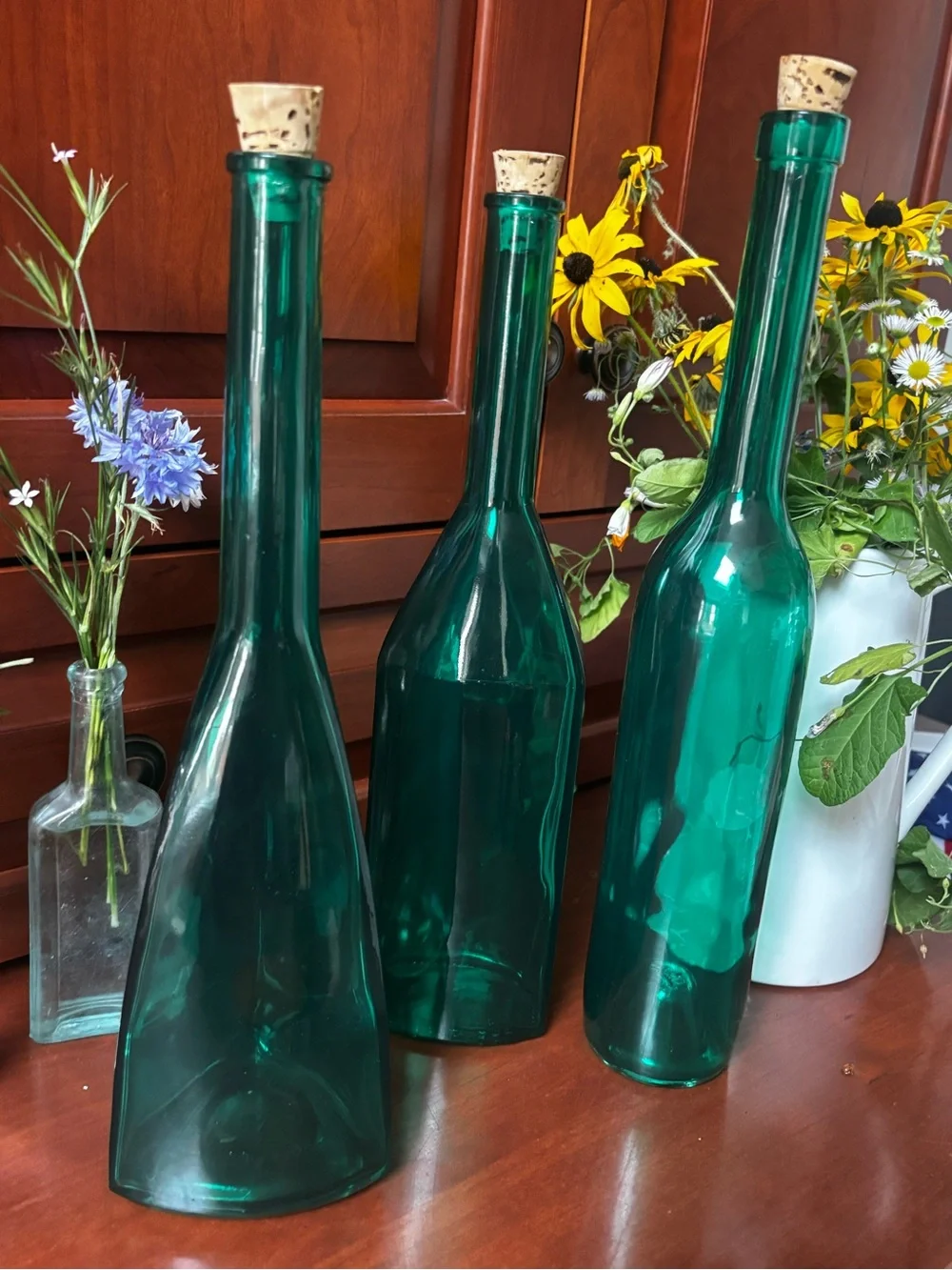 English Georgian green blown glass bottle-shape decanters set of 3